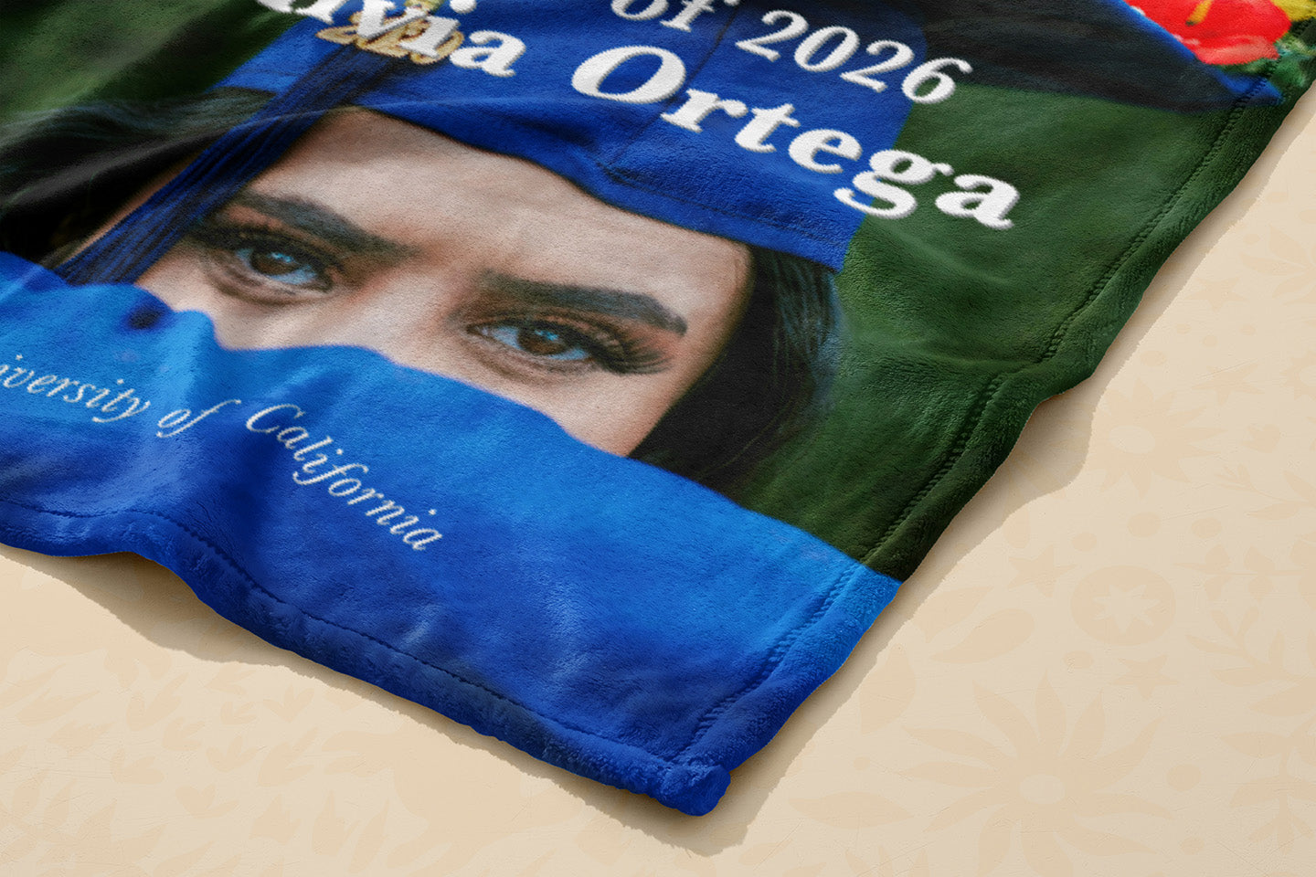 Graduation-themed fabric with a person's face and text about attending the University of California in 2026.