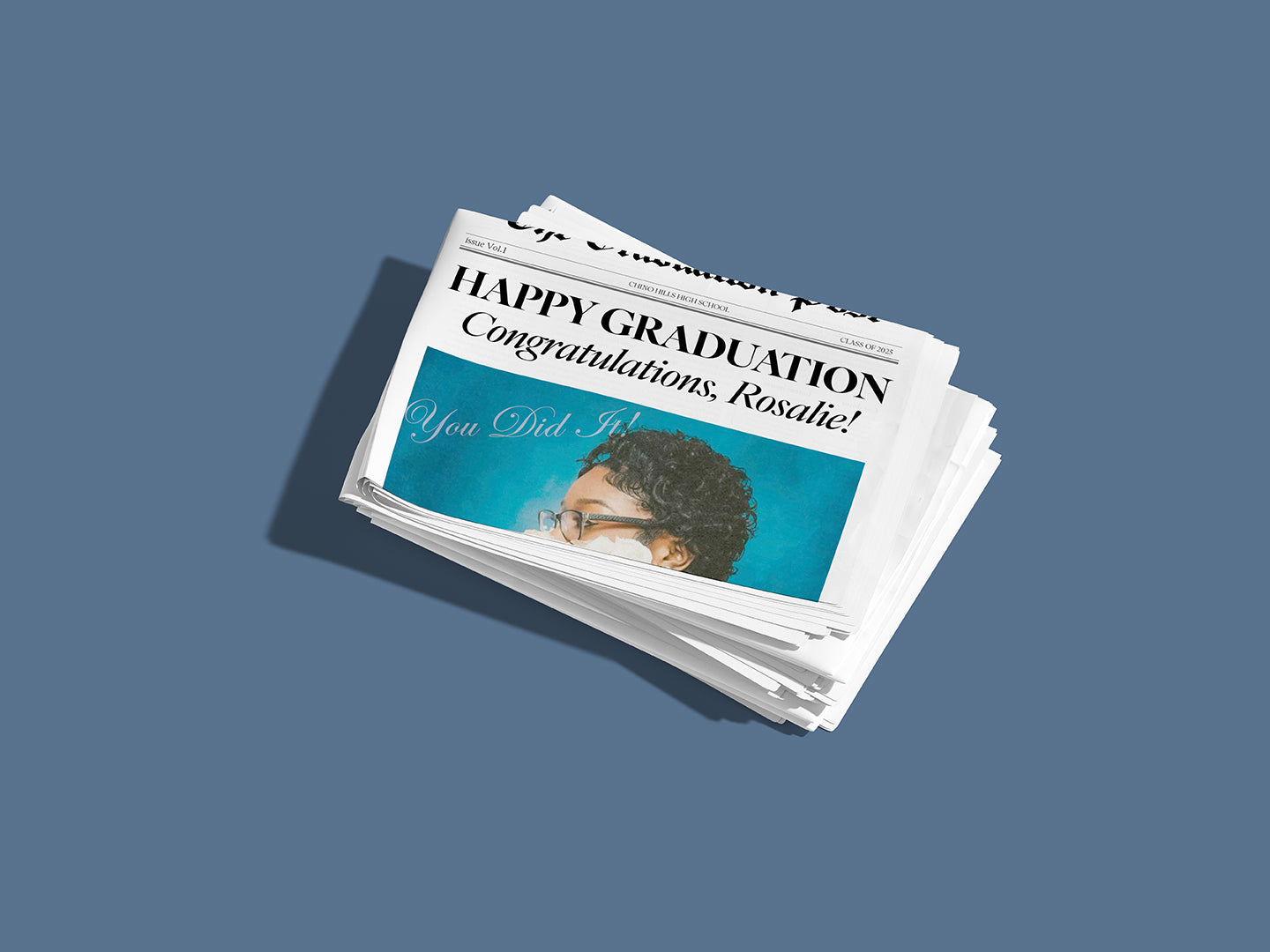Stack of graduation congratulations cards on a blue background
