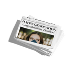 Stack of newspapers with a graduation congratulation message on a white background