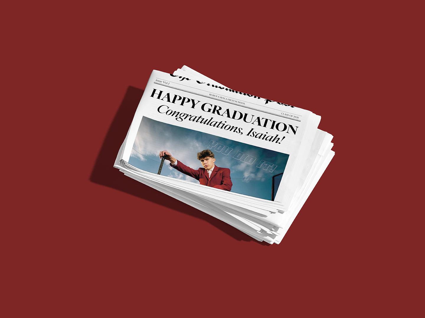 Stack of graduation-themed greeting cards on a red background