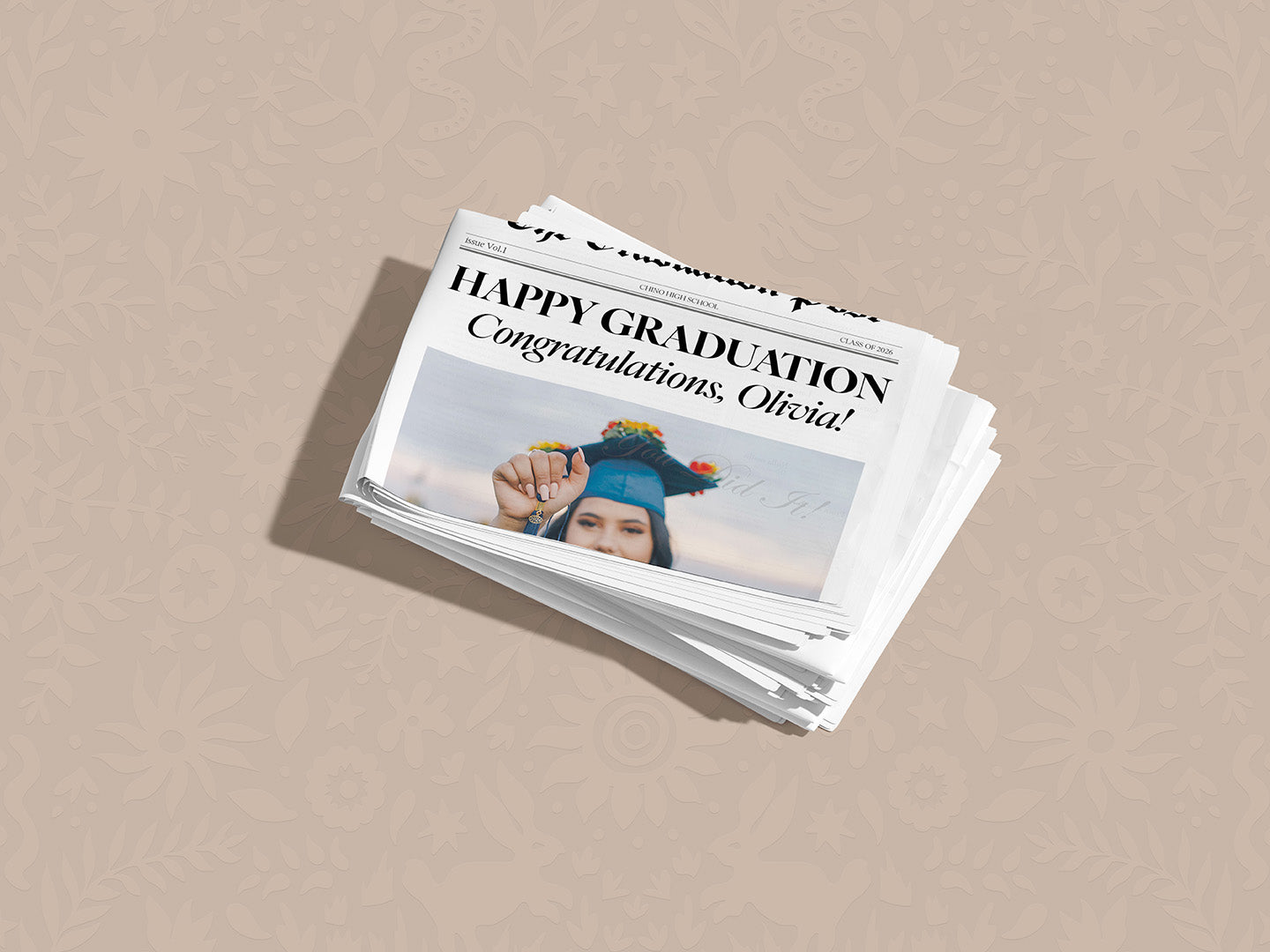 Stack of graduation-themed greeting cards on a beige background