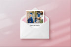 Graduation invitation with photos of a graduate in an envelope on a pink background