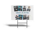 Graduation-themed sign with portraits of graduates and 'Class of 2026' text on a white background.