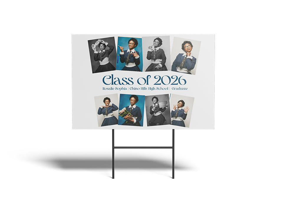 Graduation-themed sign with portraits of graduates and 'Class of 2026' text on a white background.