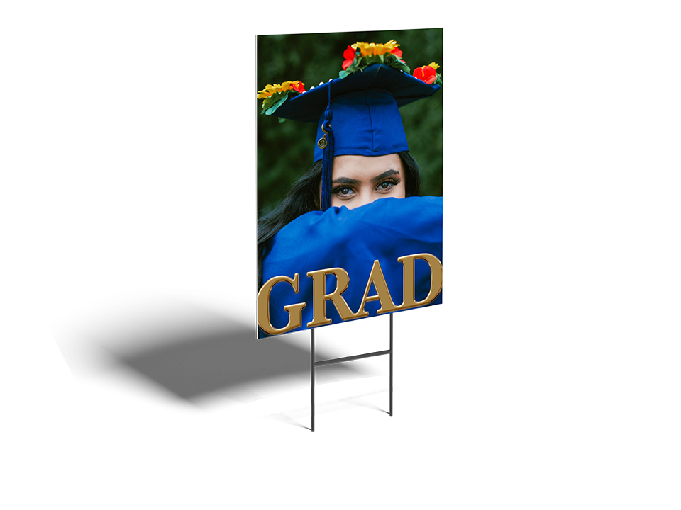Graduation-themed outdoor sign with a person in a blue graduation gown and cap.